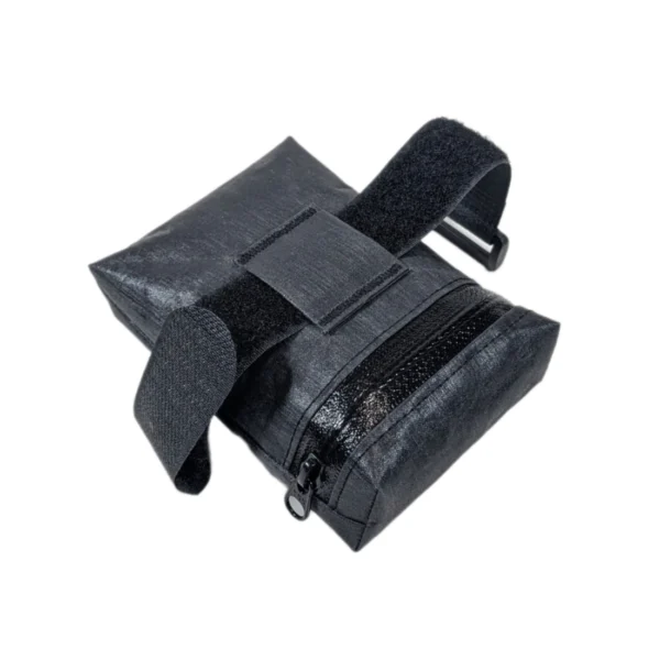 Small, lightweight, and waterproof bike saddle bag with a low-profile design, YKK zipper, and Velcro attachment.
