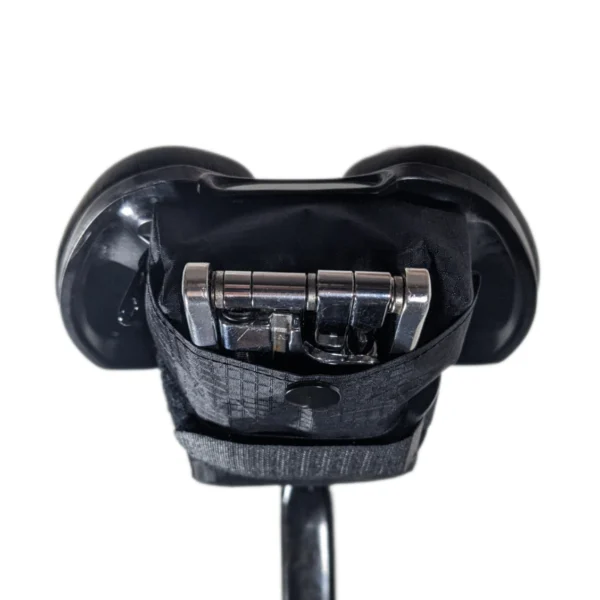 Multitool pocket on the back of a bike saddle bag for easy access to tools during a ride.