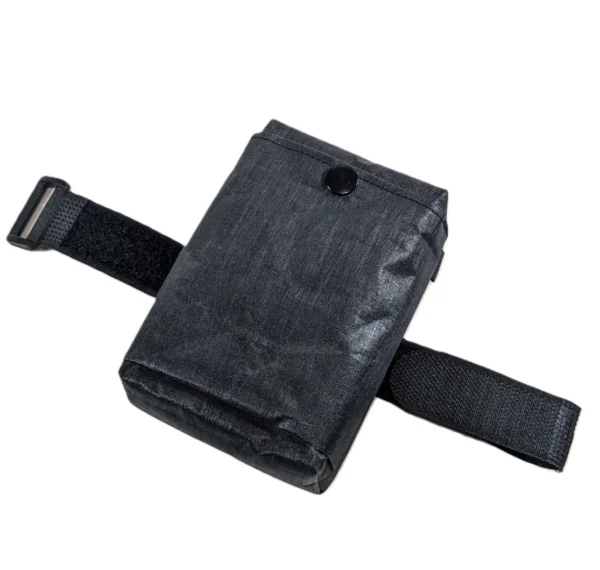 Compact bike saddle bag holding essential tools, designed for minimal storage without bulk.