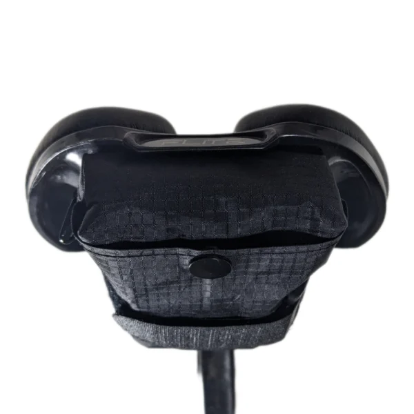 Handmade bike saddle bag attached to a mountain bike, ideal for rugged terrain and outdoor adventures.