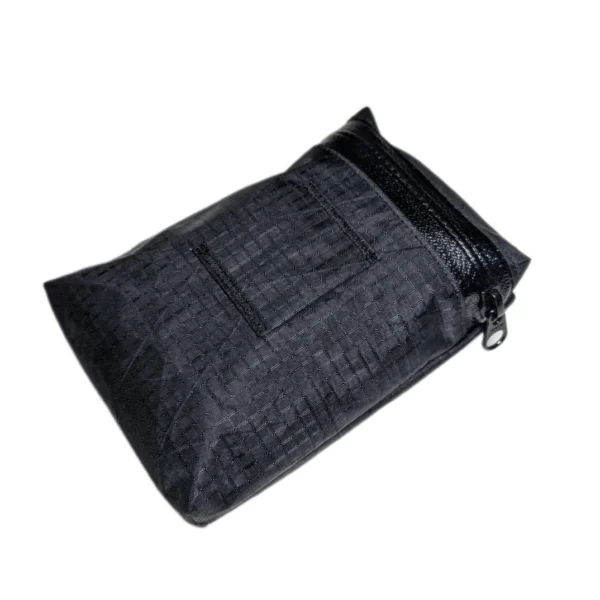 Top-down view of a low-profile, minimalist bike saddle bag mounted under a bike seat.
