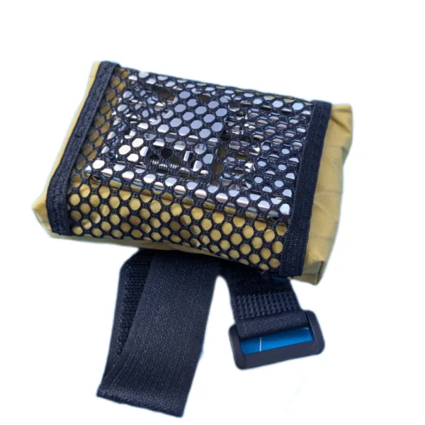 Side view of a handmade bike saddle bag showing Velcro attachment and sleek, low-profile design.