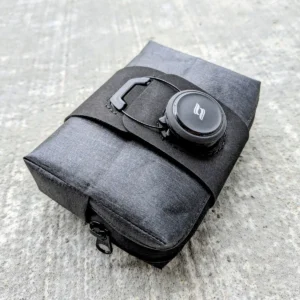 Small bike saddle bag with BOA-style rotary tightening system and low-profile compact design.